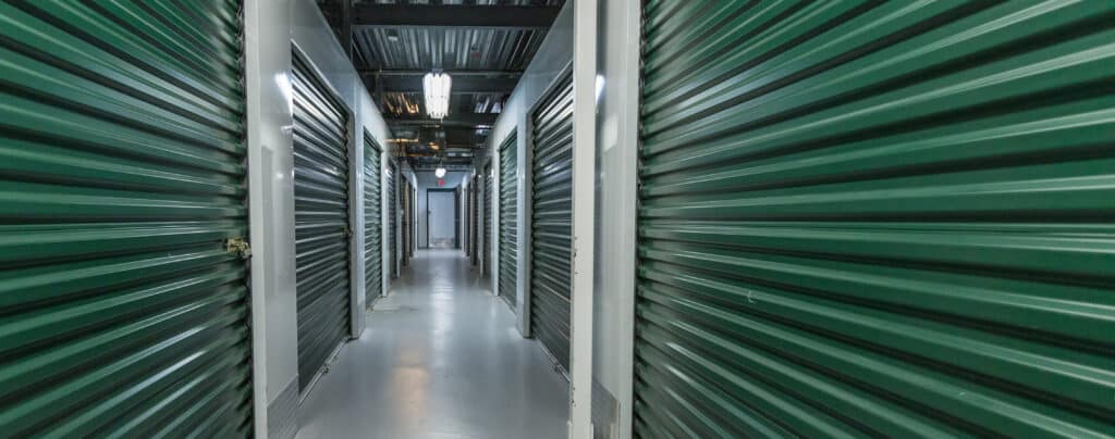Storage doors. Building interior.Industrial storage in the city. Green doors.