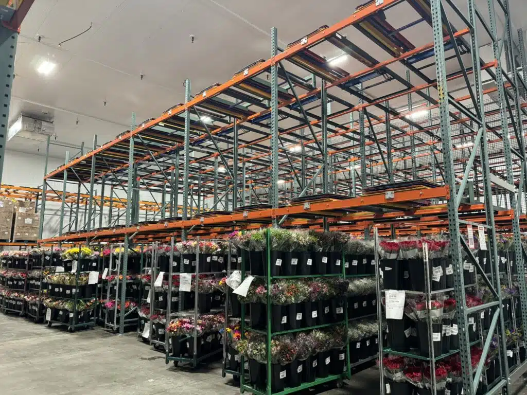 Push back racking for flower storage