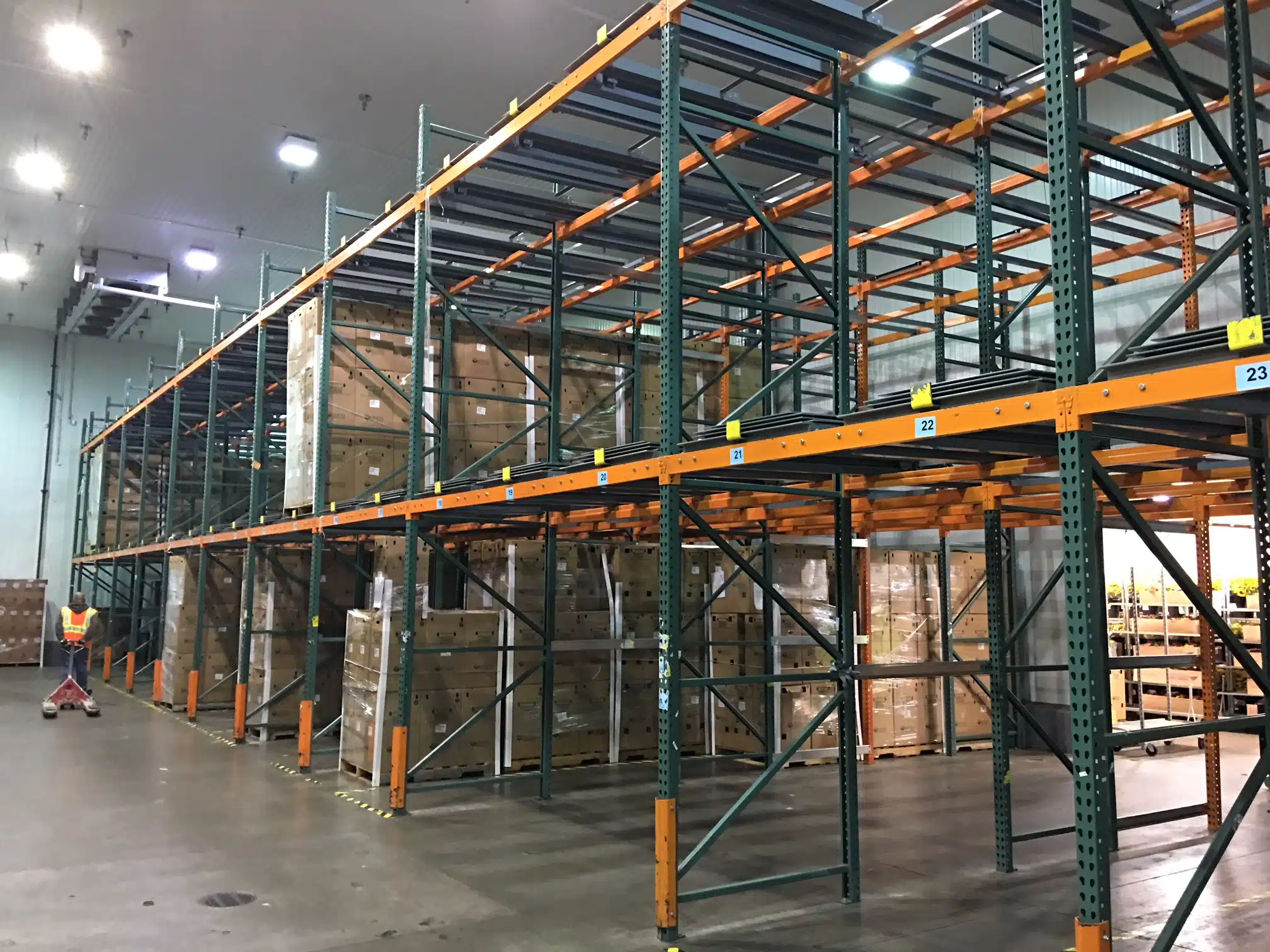 Push back rack with boxes in warehouse