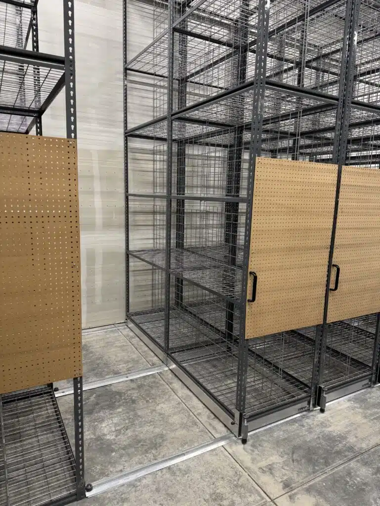 Mobile Rivet Shelving in Retail Backroom with Peg Boards