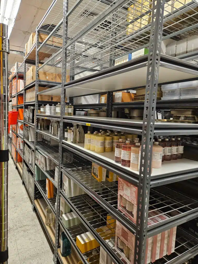 Rivet shelving storing home goods in a retail backroom