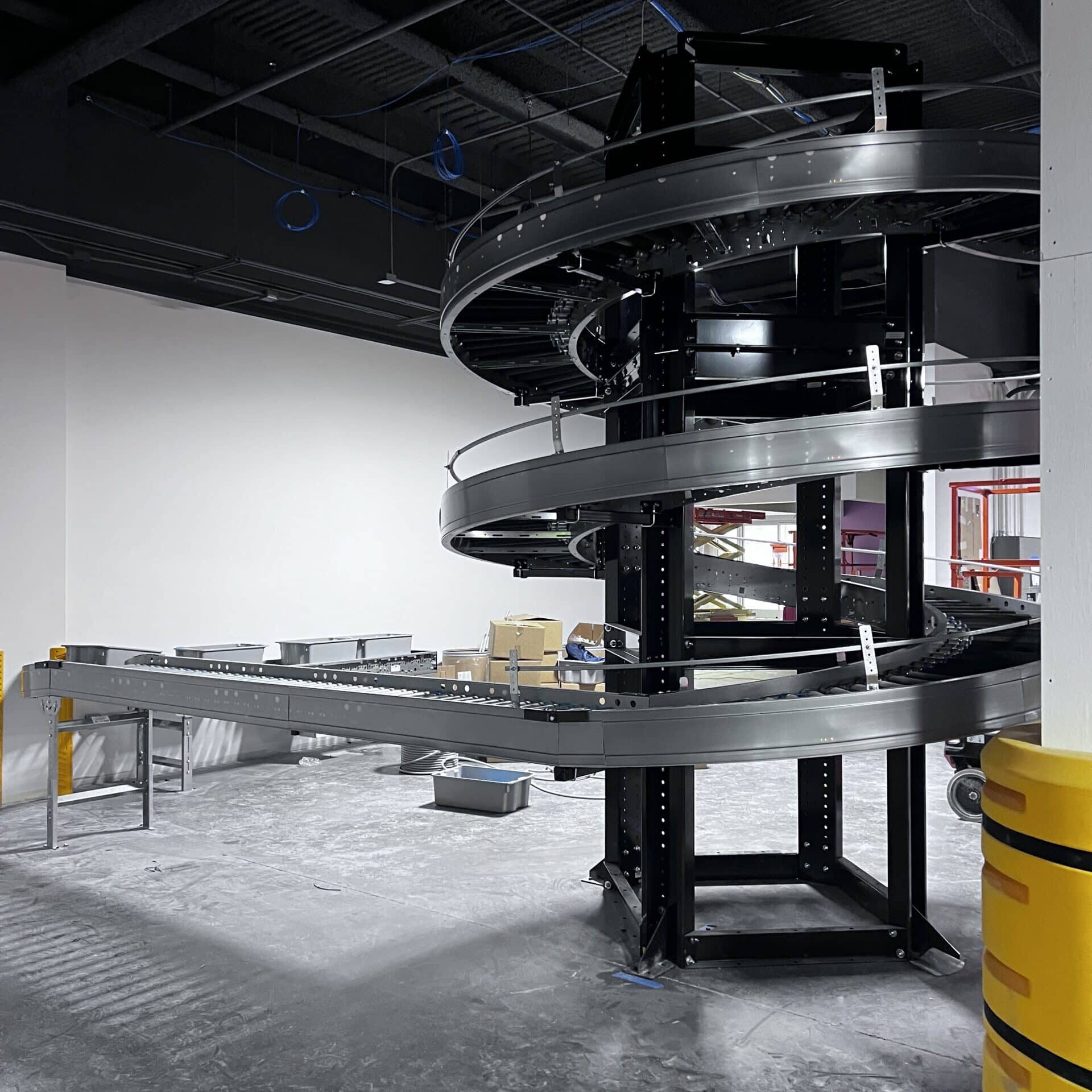 Zero pressure accumulation spiral conveyor in retail backroom