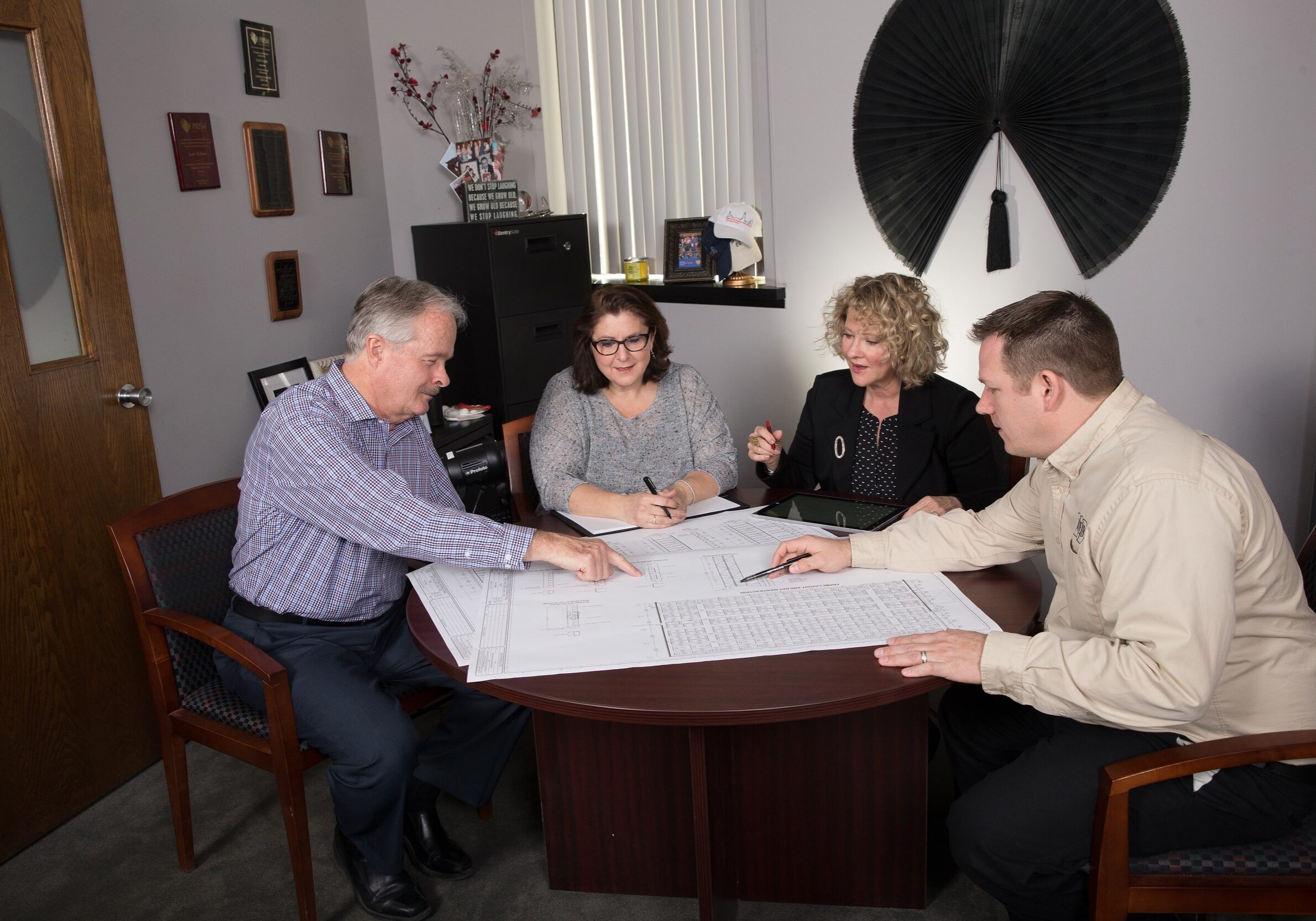 Members of the REB team discussing a project