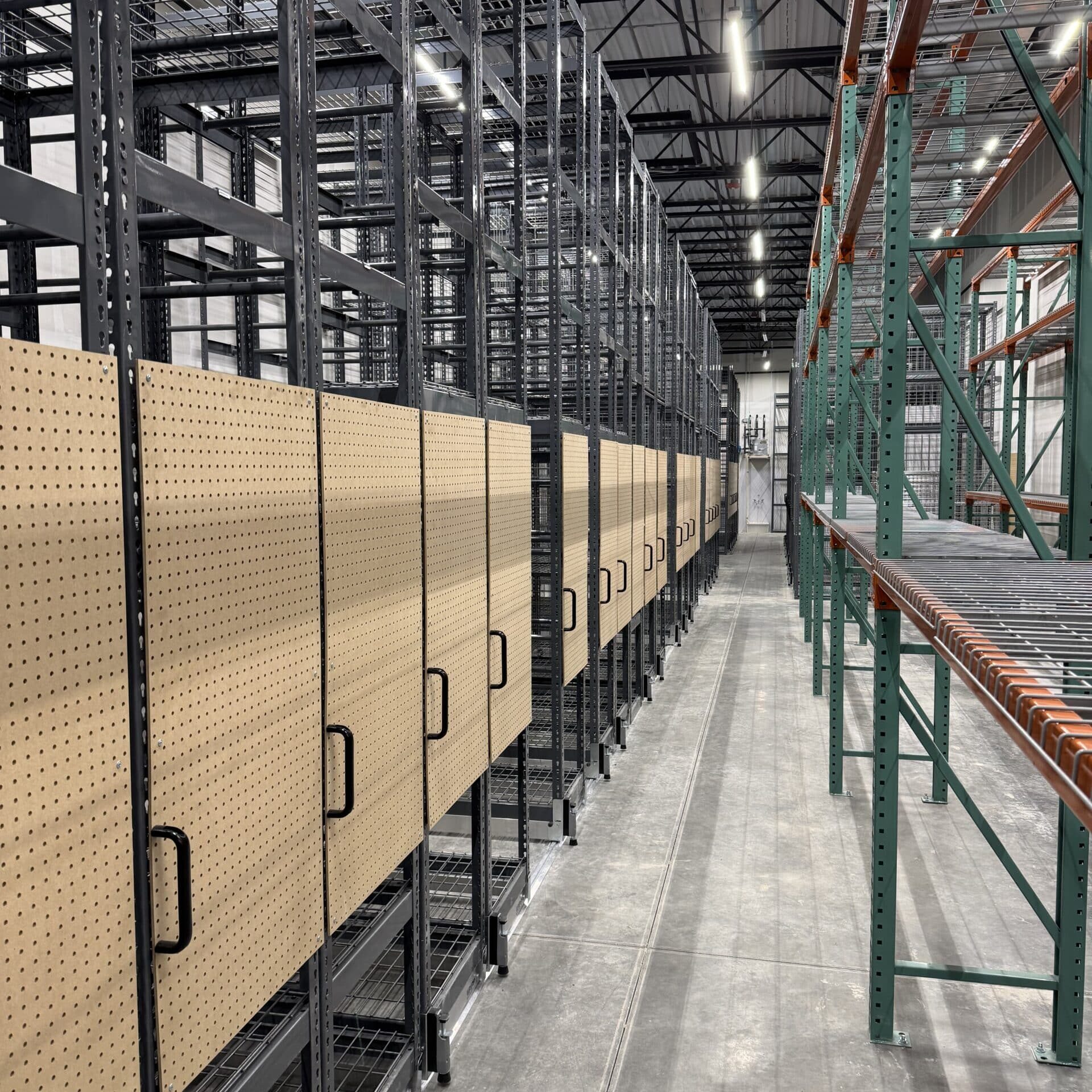 Mobile Shelving and Selective Racking in Retail Backroom with Peg Boards